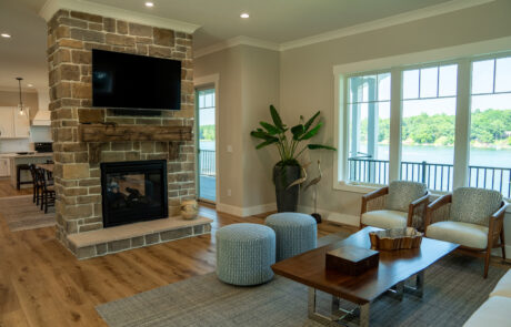 Living room with a fireplace overlooking the lake