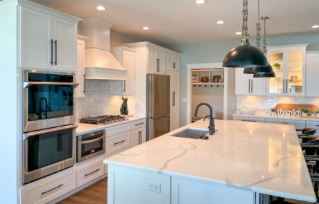 Open concept kitchen with the sink and bar seating at an island